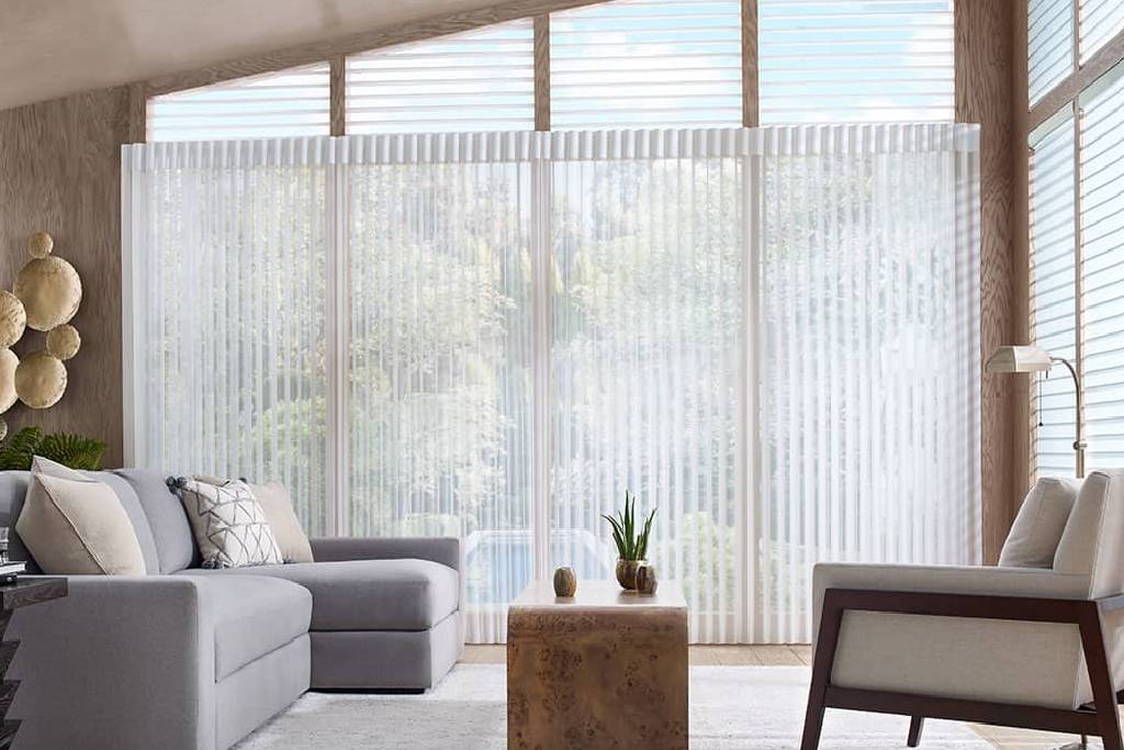 Kirsch Vertical Blinds diffusing light into a living room